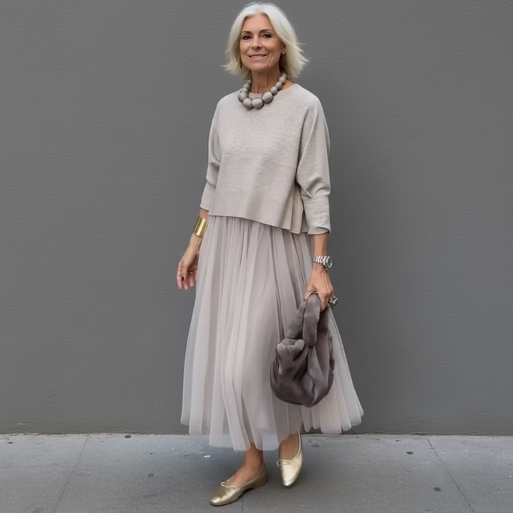 Light tan knit dress set with 3/4 sleeve top and flowing pleated tulle midi skirt