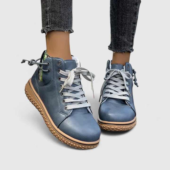 High-cut sneakers in blue with gray laces and tan textured sole