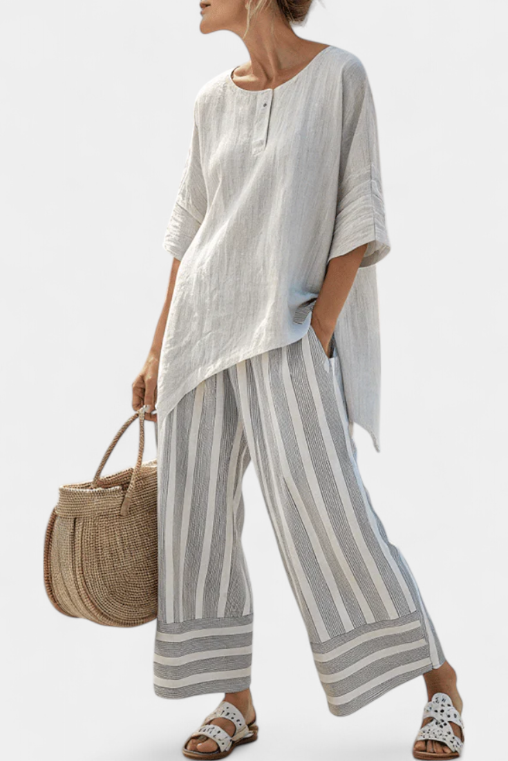 Light white asymmetric blouse with elbow sleeves; gray striped wide-leg trousers
