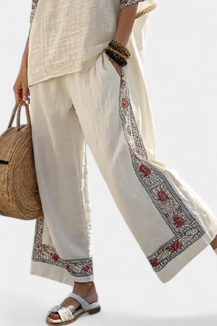 Wide-leg linen trousers with embroidered hem and long side border stripe