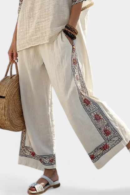 Wide-leg linen trousers with embroidered hem and long side border stripe