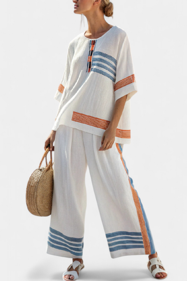 White tunic top with orange-and-blue stripe panels and matching wide-leg trousers