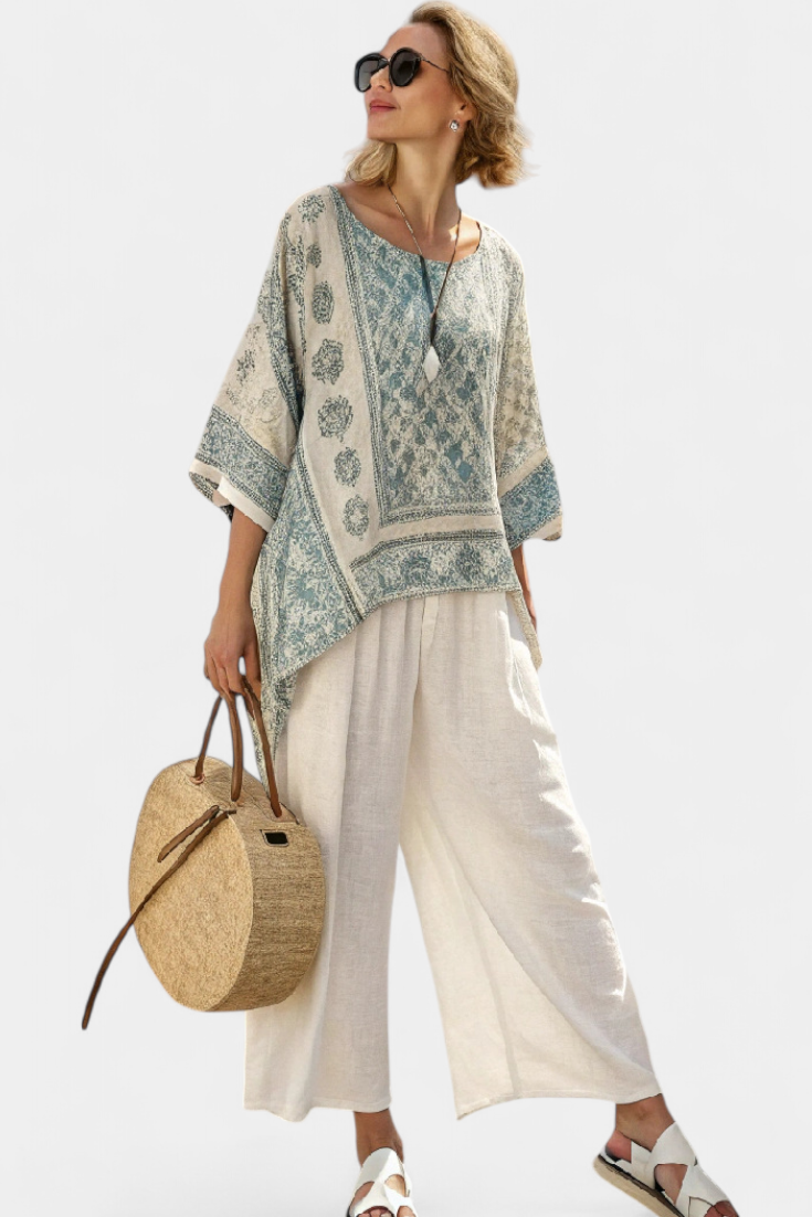Blue-green printed blouse over white wide-leg trousers, wide sleeves