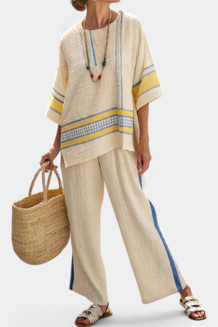 Linen trousers set in light beige with blue and yellow striped top and wide-leg pants