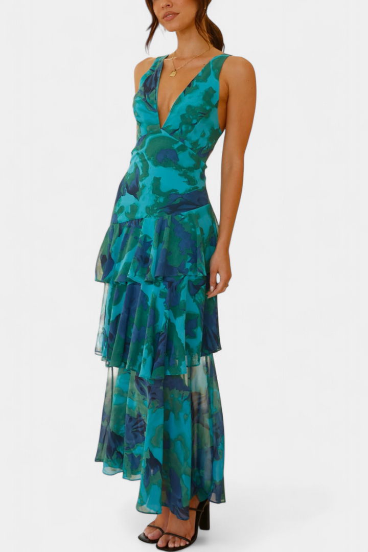 Tiered ruffle dress with V-neck and sleeveless bodice, teal floral print and layered skirt