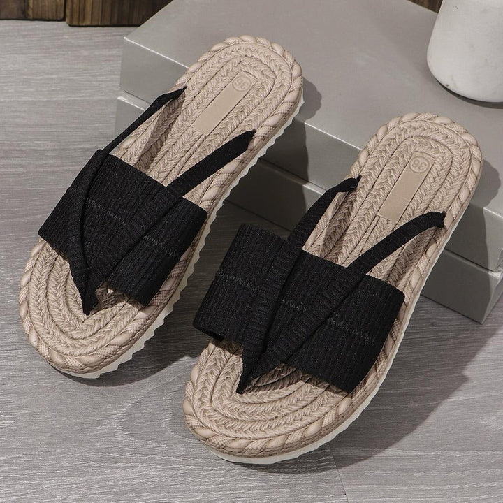 Black knit toe-loop slide sandals with braided jute-look sole and textured tread