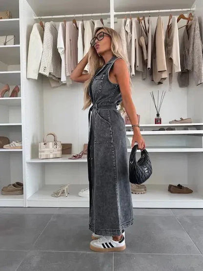 Gray denim maxi dress with sleeveless collared front and tie waist