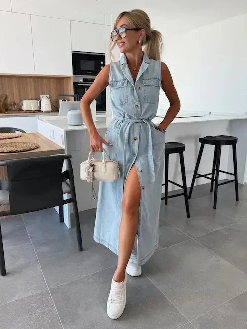 Light blue denim maxi dress with button-down front, tie belt, and thigh-high slit