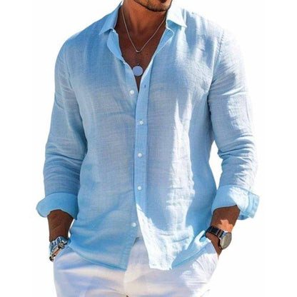 Light blue button-up shirt, long sleeves, open collar placket