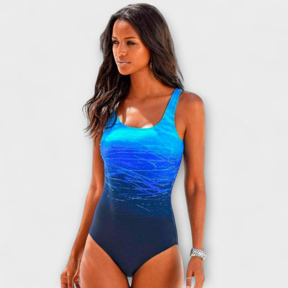 Blue one-piece sport swimsuit, scoop neck, dark navy legs.