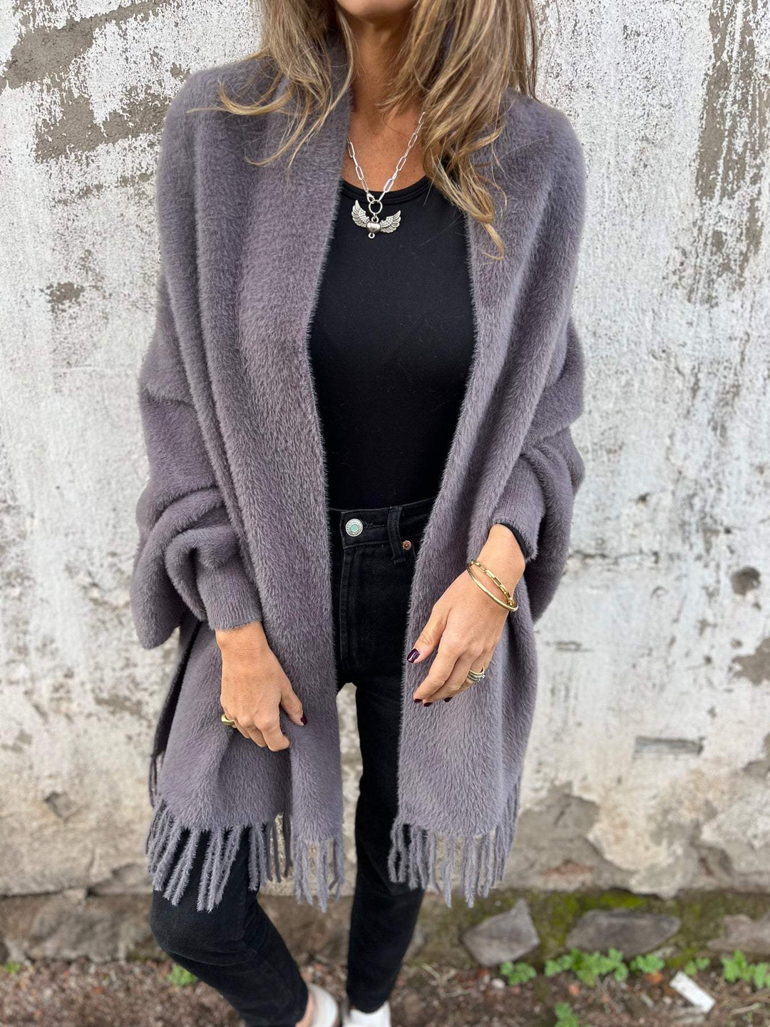 Gray draped open-front cardigan with shawl collar and long fringed hem panels