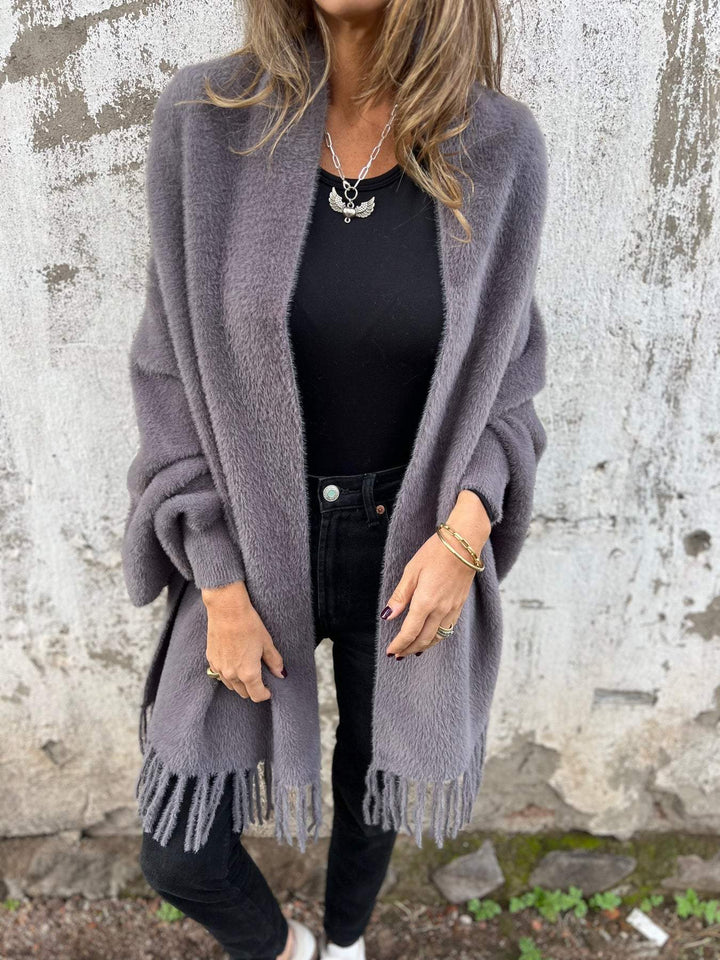 Gray draped open-front cardigan with shawl collar and long fringed hem panels