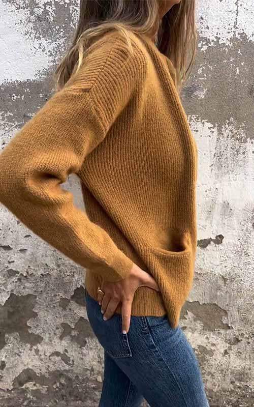 Brown zip-up knit cardigan in a side view with ribbed cuffs and front zipper.