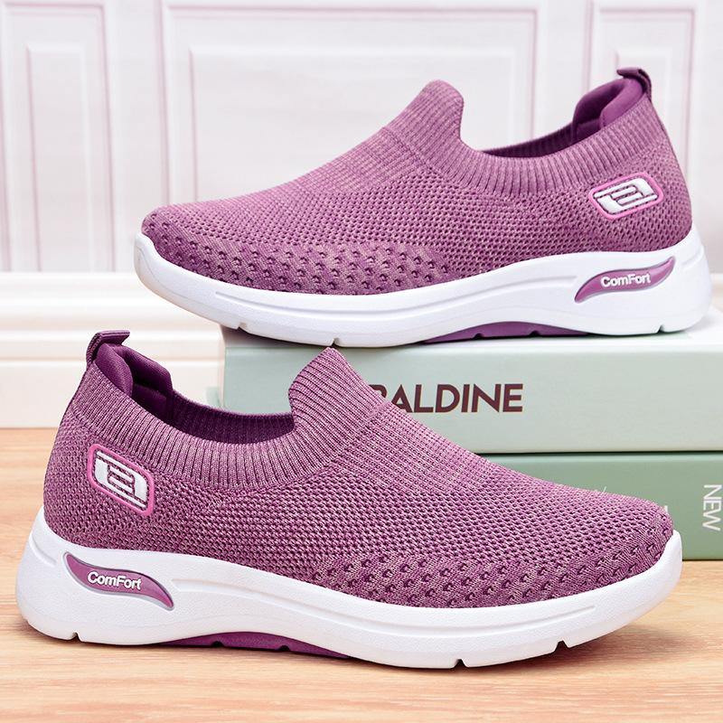 Purple slip-on knit shoes with white sole and side comfort logo
