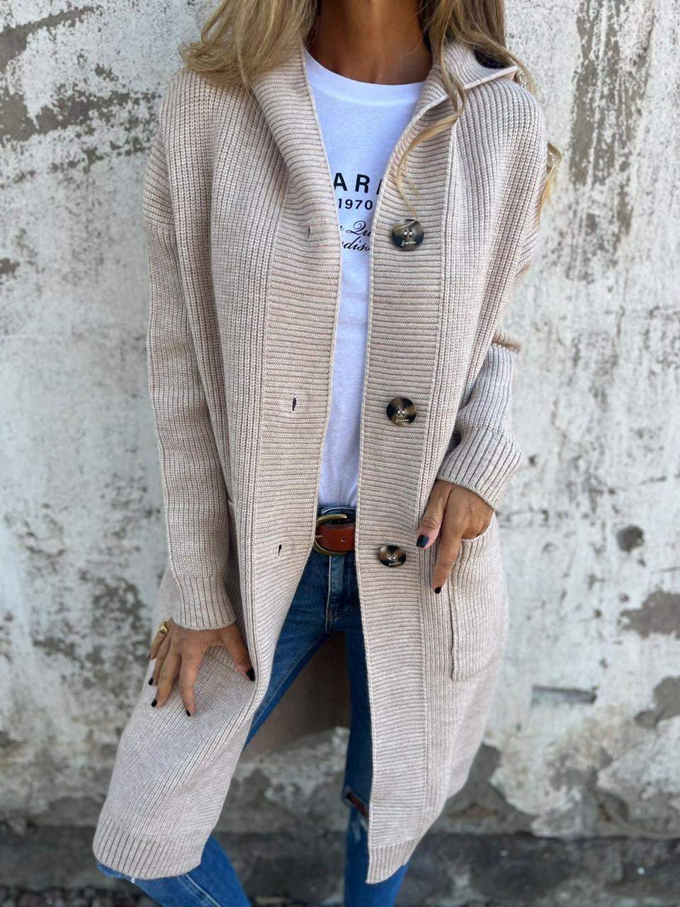 Beige long open-front cardigan with hood and oversized round button details.
