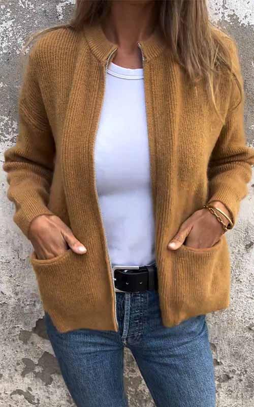 Brown zip-up knit cardigan with ribbed trim, front zipper, and side pockets.
