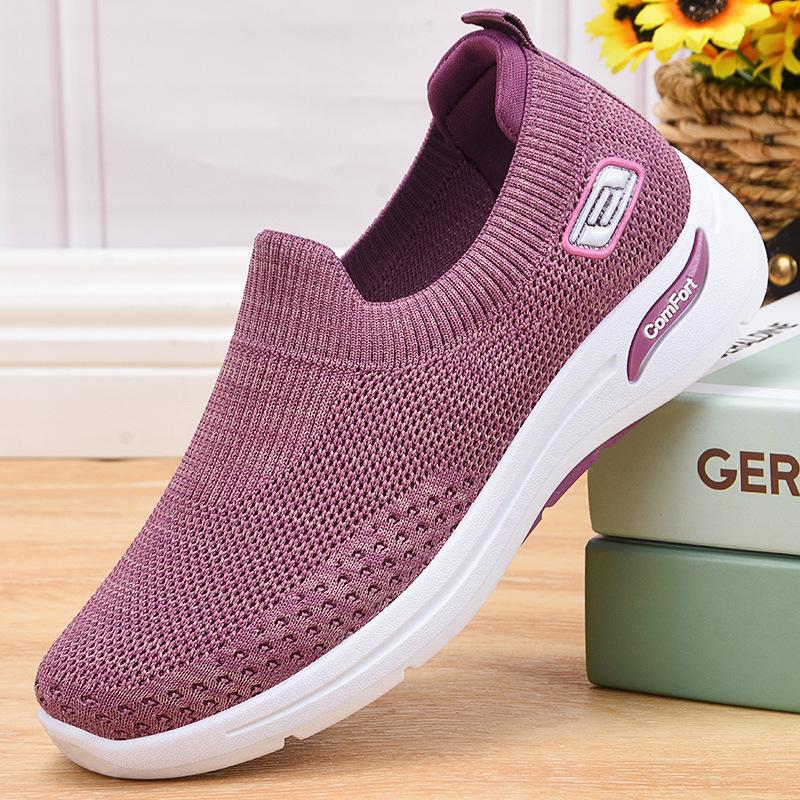 Purple slip-on knit shoes with white sole and padded collar