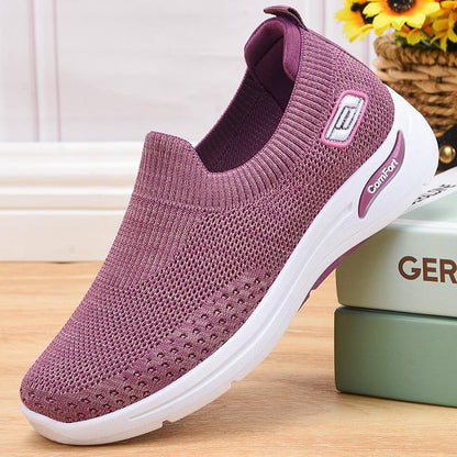 Purple slip-on knit shoes with white sole and padded collar