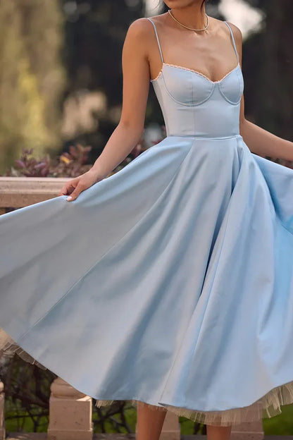 Powder blue satin midi dress with spaghetti straps, sweetheart bodice, and flared skirt
