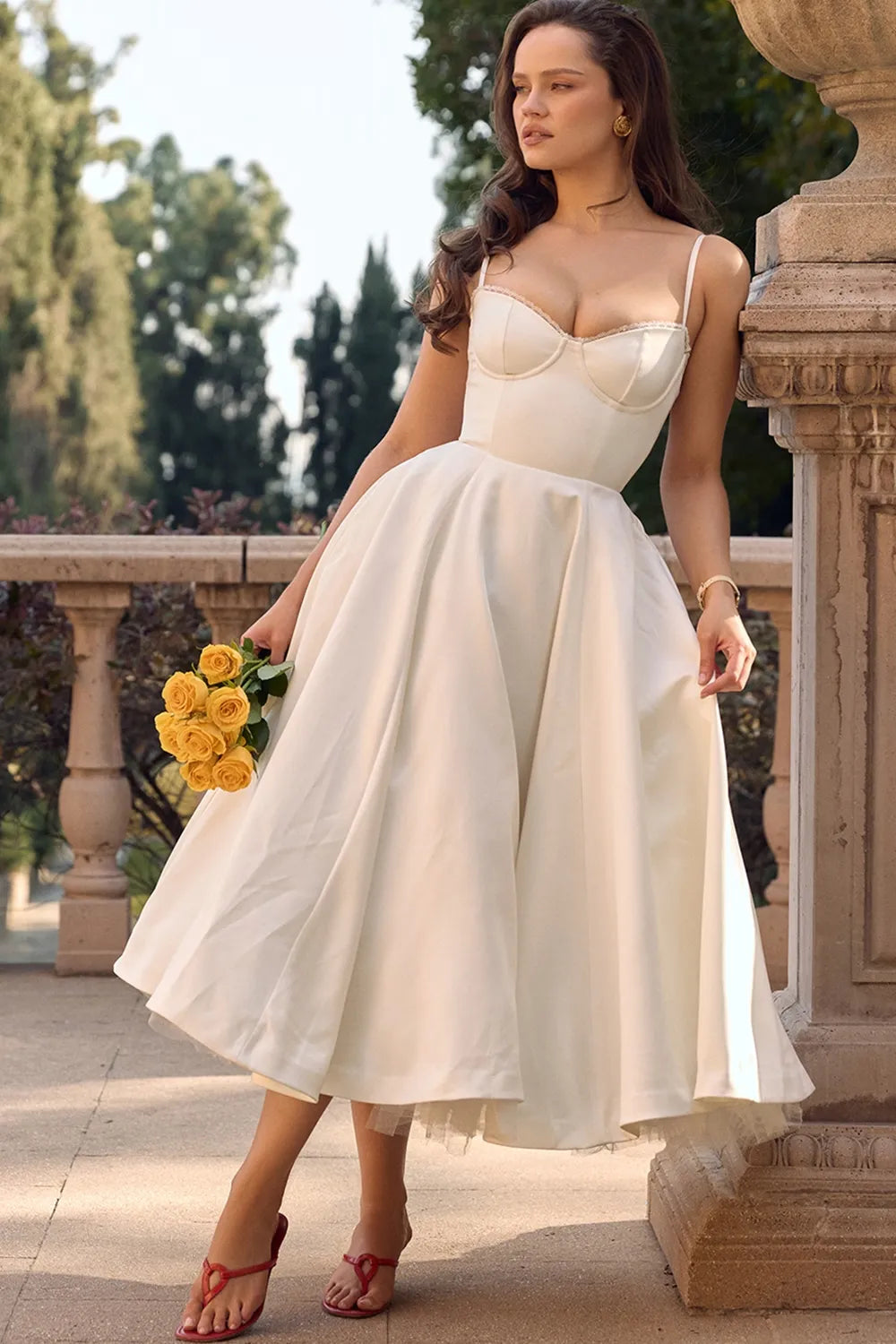 Cream satin midi dress with thin straps, sweetheart bust, and layered tulle skirt