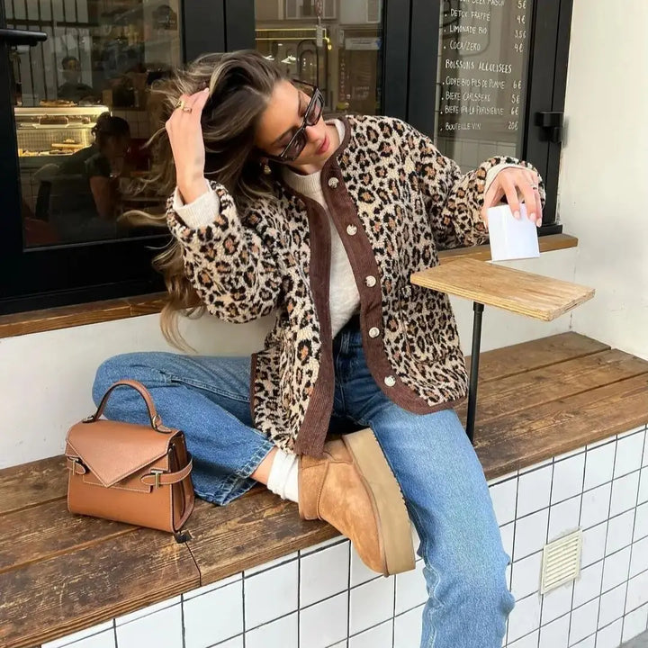 Leopard print cardigan with dark button front, long sleeves, and casual drape