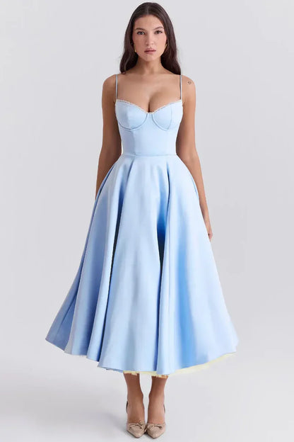 Light blue satin midi dress with spaghetti straps, sweetheart bodice, and pleated skirt