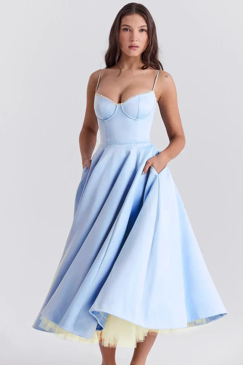 Light blue satin midi dress with thin straps, sweetheart neckline, and layered tulle hem