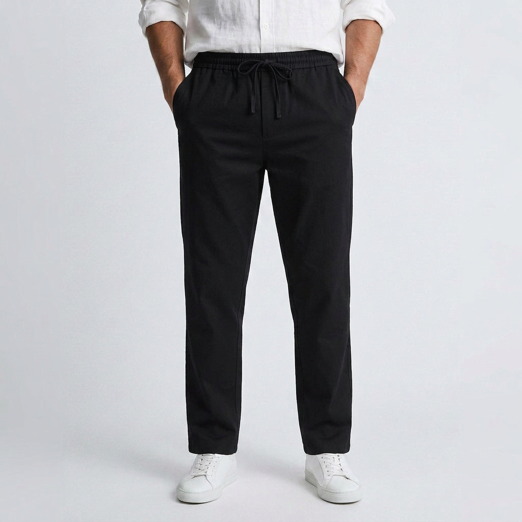 Black fluid linen pants with elastic drawstring waist and relaxed ankle-length fit