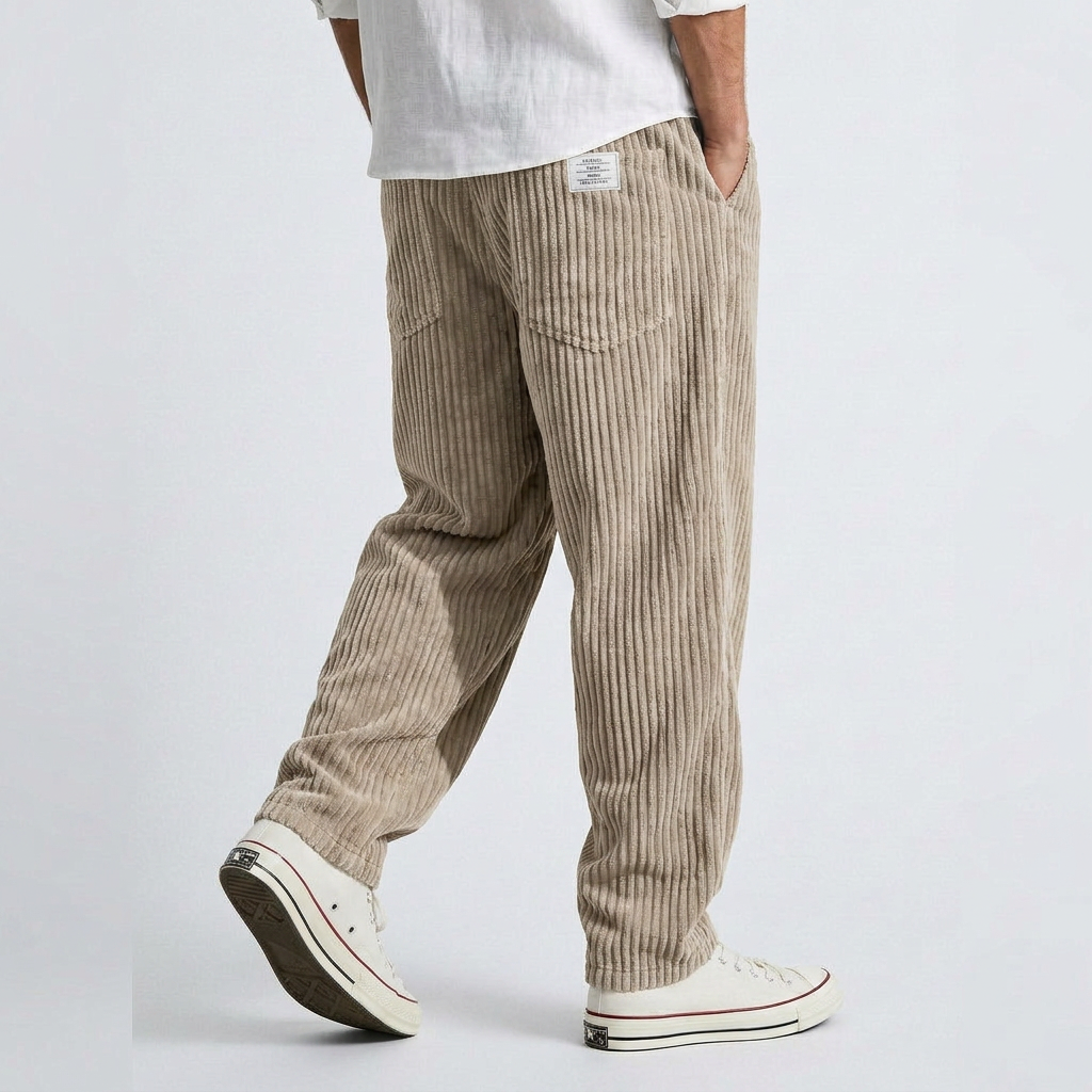 Beige wide-leg corduroy pants with vertical ribbed texture and elastic waistband