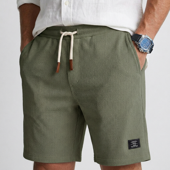 Green textured knit shorts with drawstring waist and side pockets