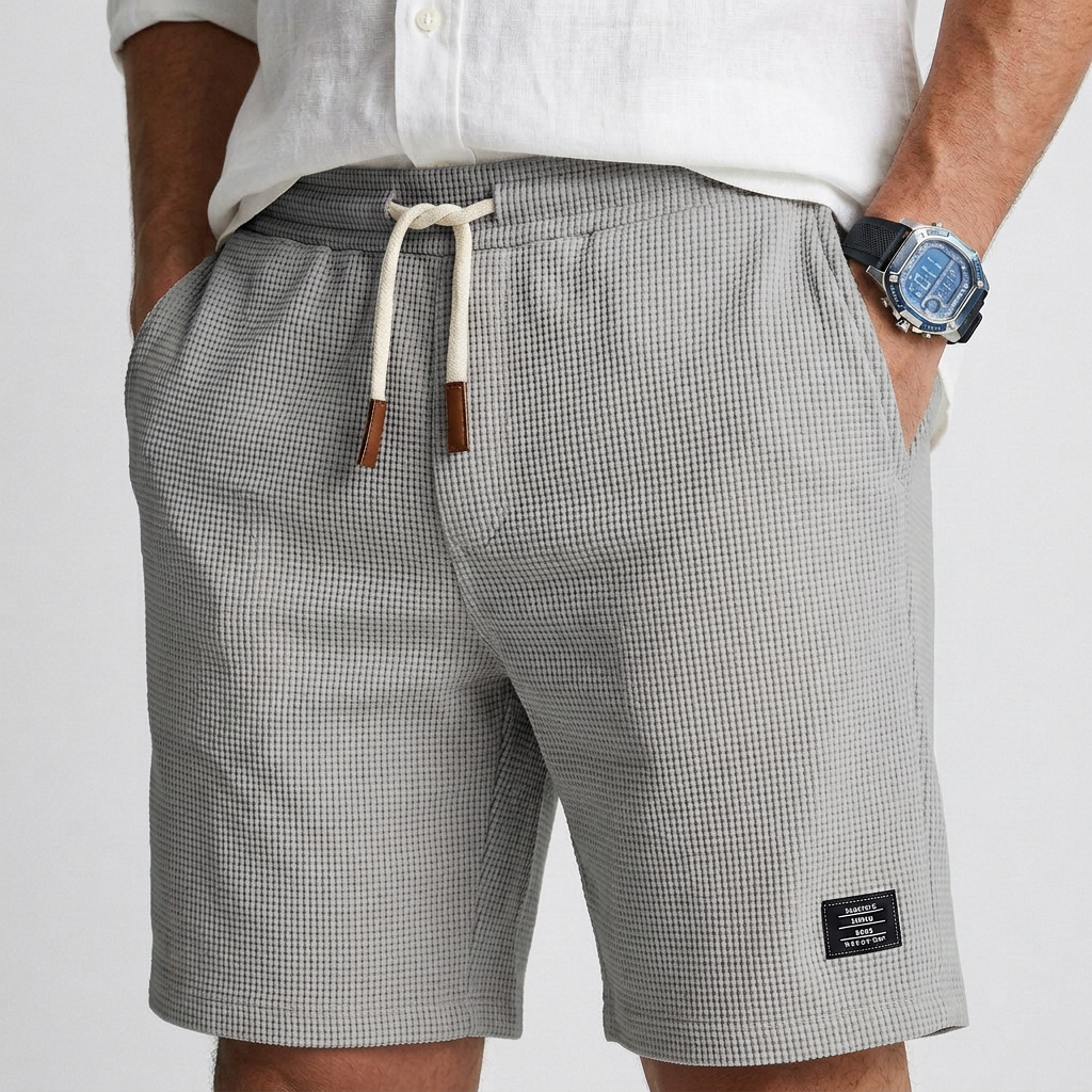 Gray textured knit casual shorts with drawstring waist and patch pocket label