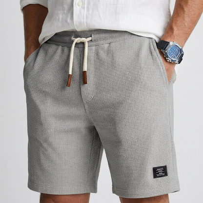 Gray textured knit casual shorts with drawstring waist and patch pocket label
