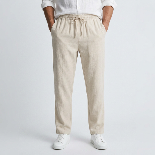 Beige linen pants with elastic drawstring waist and relaxed straight legs