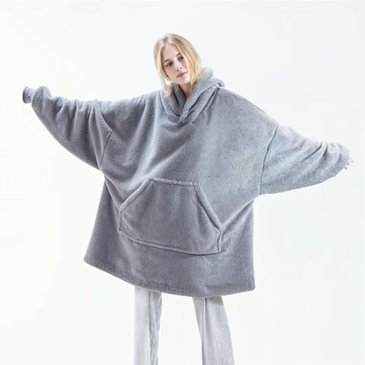 Grey fleece-lined oversized hoodie with hood and front kangaroo pocket, long sleeves.
