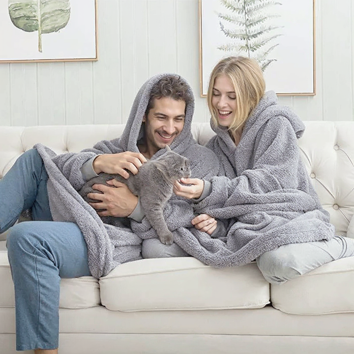 Grey fleece-lined oversized hoodie with hood and front kangaroo pocket.