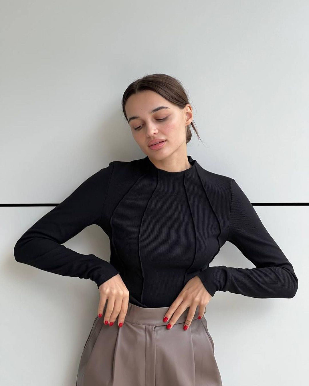 Women’s long sleeve ribbed top in black with half-zip front