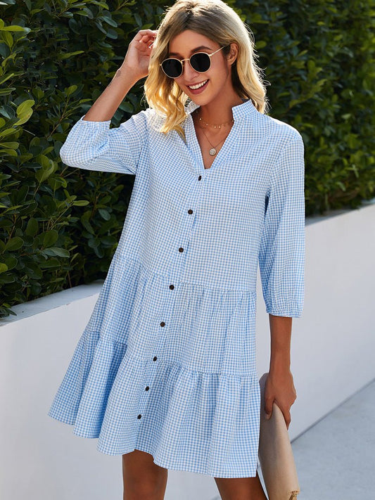 Blue gingham midi dress with button front, V-neck, and three-quarter puff sleeves