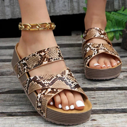 Orthopedic sandals, tan snake-print straps, gold buckle detail, cushioned platform wedge