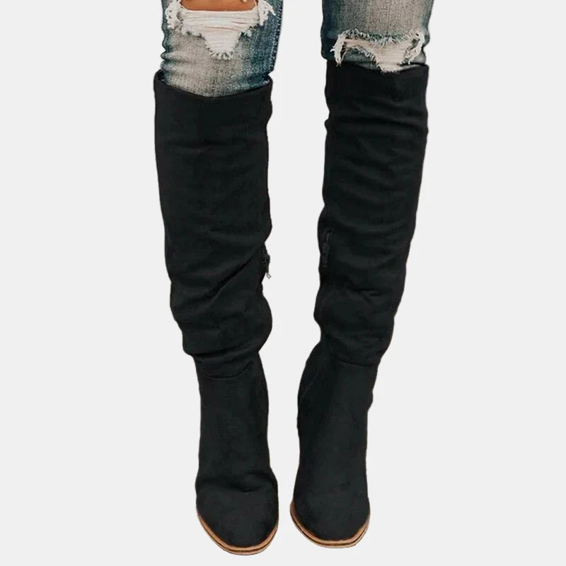 Black slouchy heeled knee-high boots with stacked block heel and pointed toe
