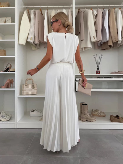 White 2-piece set from back: cap-sleeve top and pleated wide-leg trousers