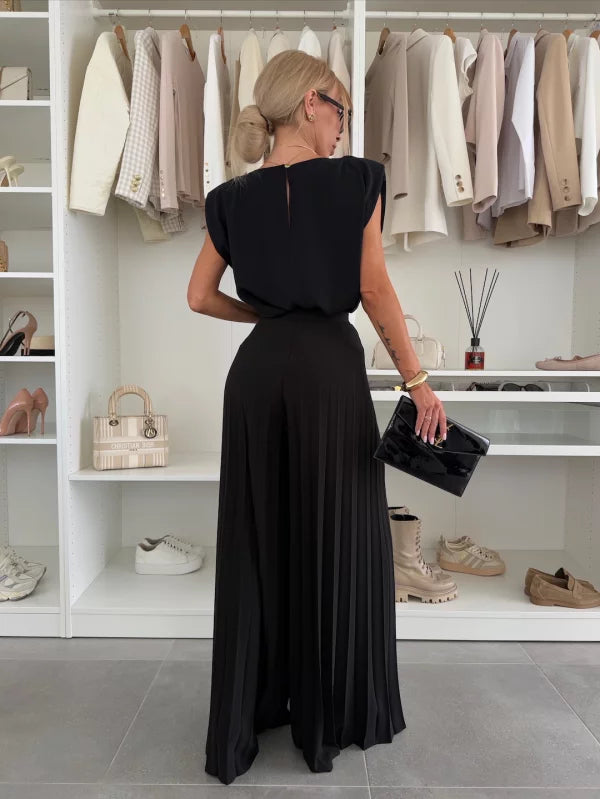 Black 2-piece set from back: cap-sleeve top and pleated wide-leg trousers