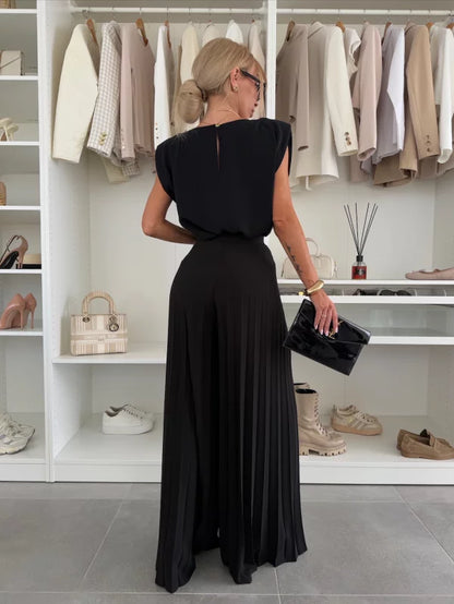 Black 2-piece set from back: cap-sleeve top and pleated wide-leg trousers