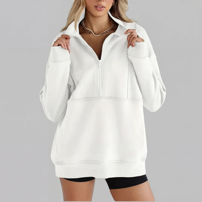 White oversized half-zip sweatshirt with front zipper and kangaroo pocket, ribbed cuffs