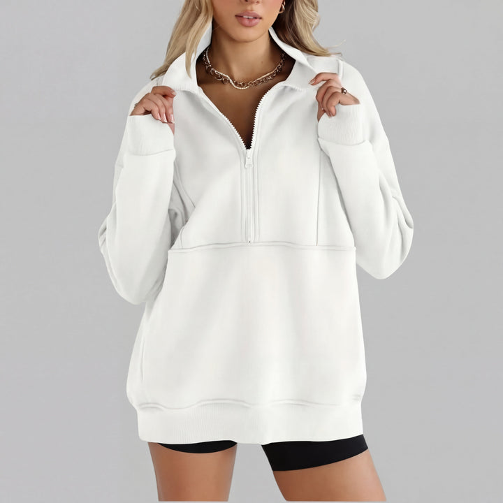 White oversized half-zip sweatshirt with front zipper and kangaroo pocket, ribbed cuffs