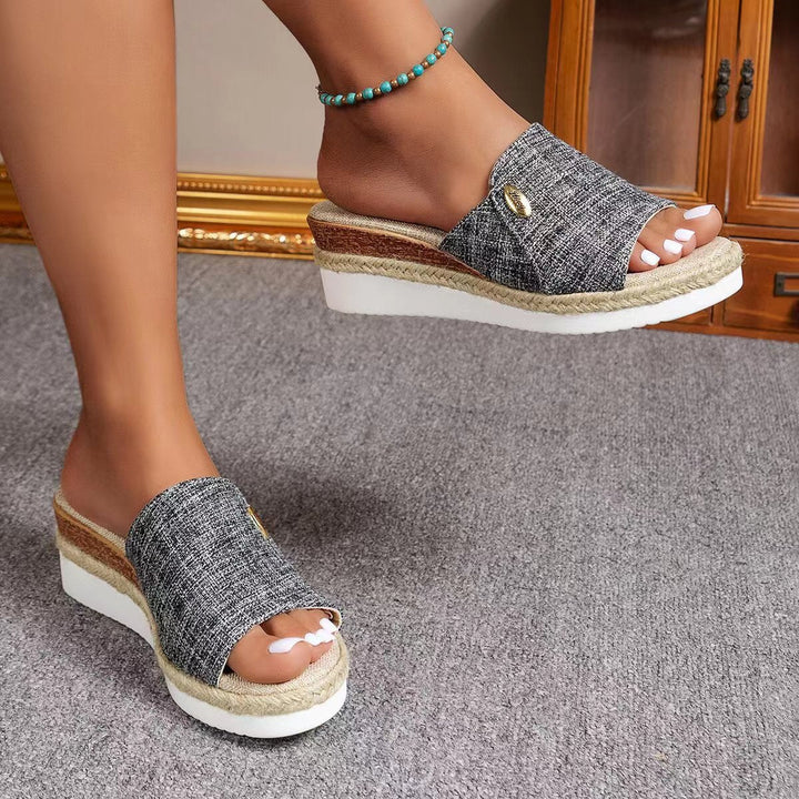 Charcoal textured ergonomic sandals with open toe and tan espadrille-style sole trim