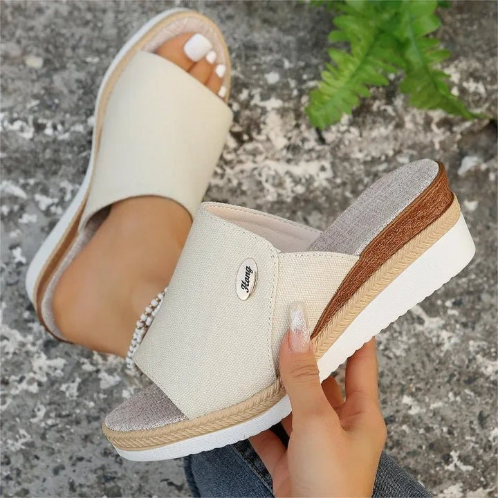 Beige fabric ergonomic sandals with open toe and tan espadrille-style sole trim