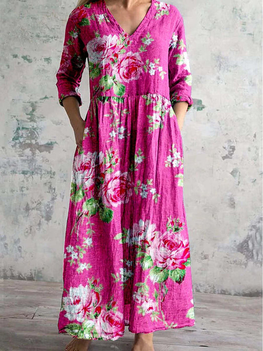 Pink floral maxi dress with V-neck, 3/4 sleeves, and gathered waist