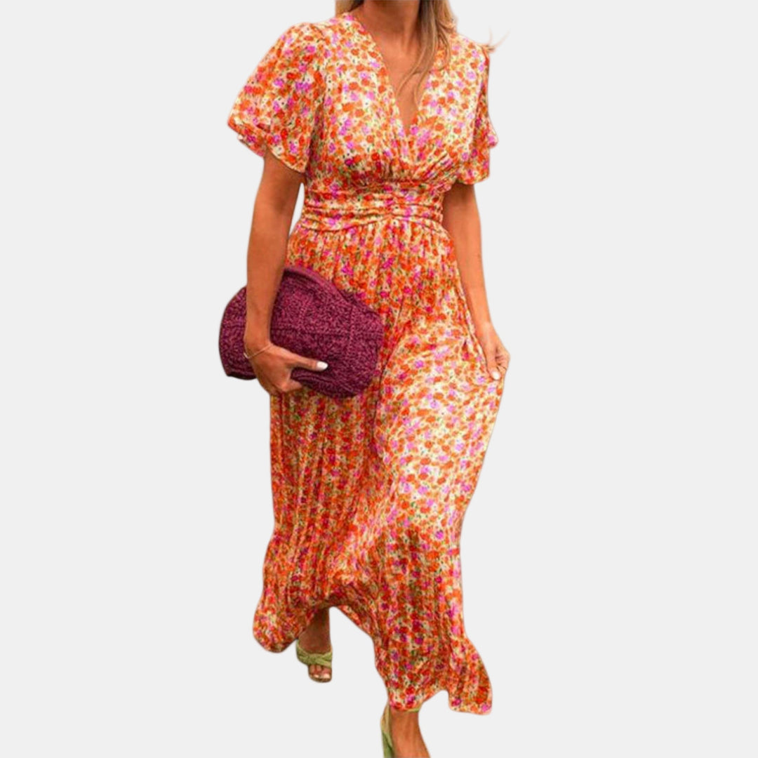 Floral maxi dress side view with V-neck, smocked waist, flowing tiered skirt