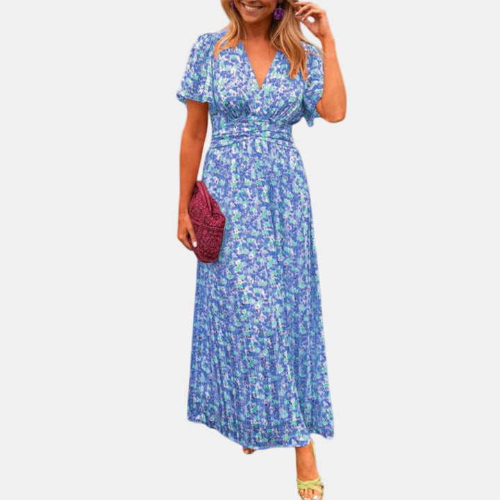 Floral maxi dress with V-neck, short sleeves, and smocked waist in blue multicolor