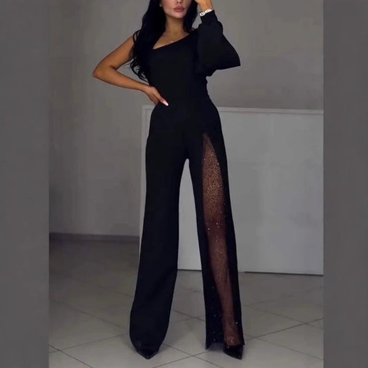 Black one-shoulder flared romper with sheer side panel and long wide-leg silhouette